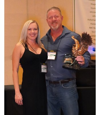 Russ & Rebecca receiving ARCA award
